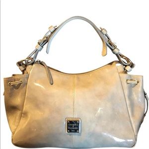 Dooney & Bourke cream patent leather handbag.